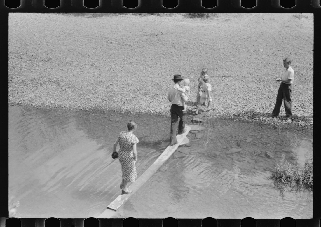 Mountain people leaving the Primitive Baptist Church in Morehead, Kentucky and going down to the creek for a baptizing