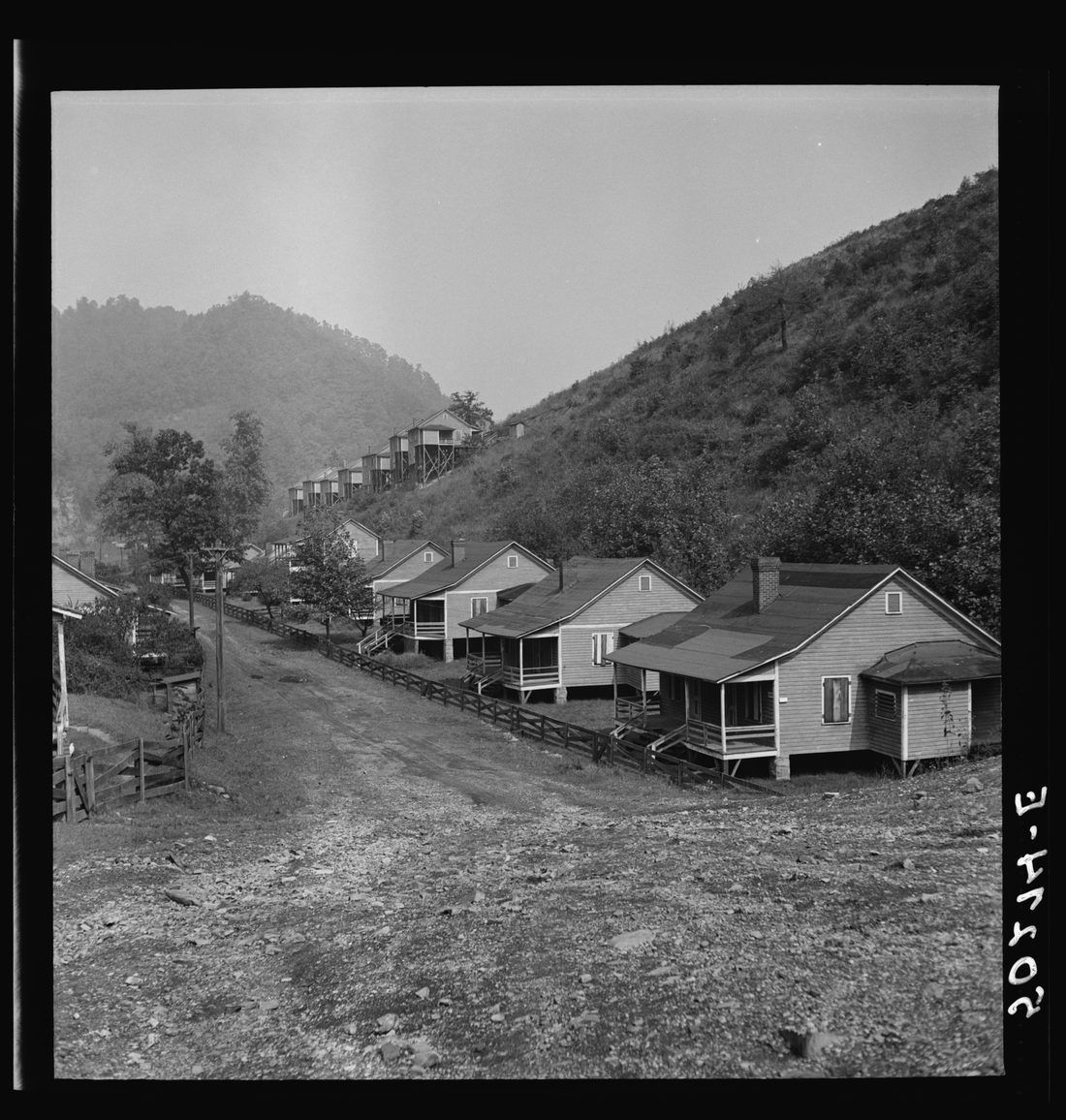 Boarded-up homes in abandoned mining town. Twin Branch, West Virginia. Once very nice, owned by Ford. About four years ago when an attempt to organize it was made, Ford closed it d
