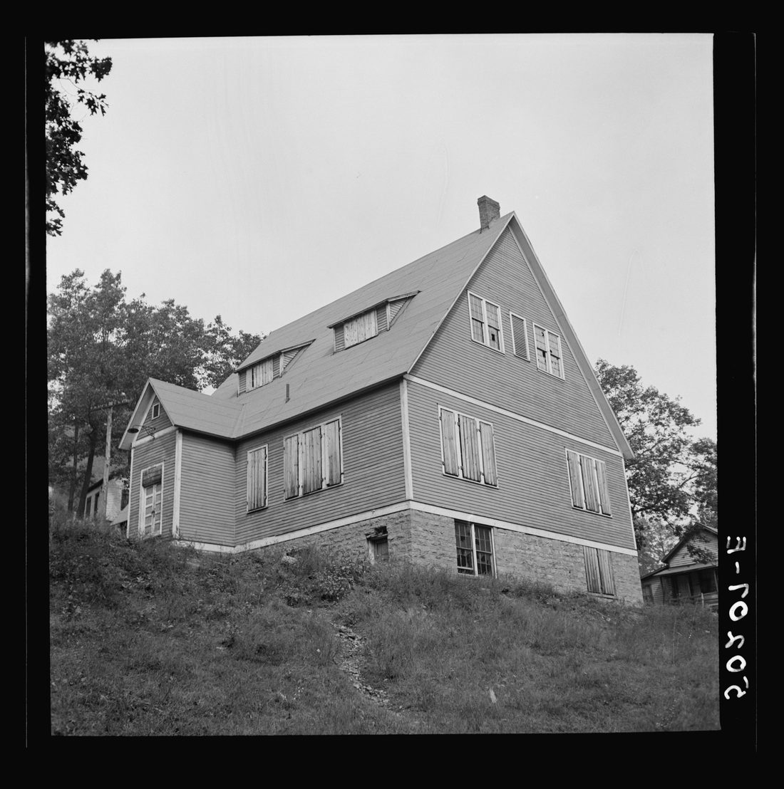 Boarded-up church in abandoned mining town of Twin Branch, West Virginia. See 50274-E